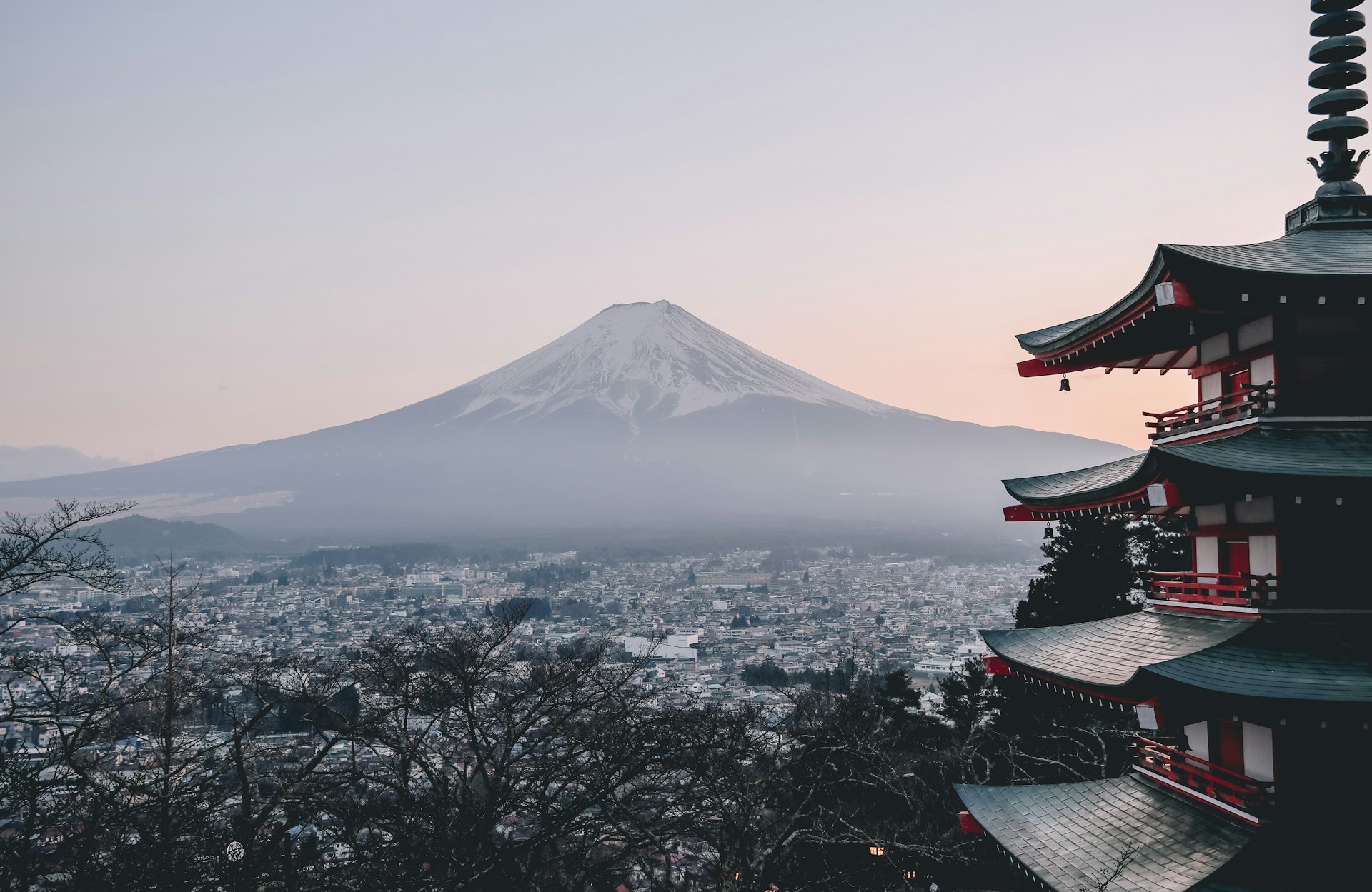 Mount Fuji at dawn beside a five-storey pagoda